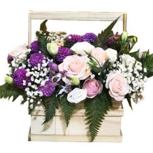 A wooden basket of 3 roses