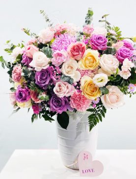 Two Dozen Assorted Roses with Orchids